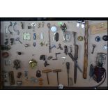 A fabulous collection of mounted handles, hinges, tools, doorknobs,