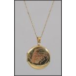 A fine 9ct gold ladies necklace complete with clasp having a yellow metal locket.