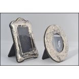 2 small contemporary silver picture / photo frames with ribbon and foliate decoration each having