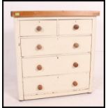 A painted Victorian two over three chest of drawers finished with a pine scrubbed top.