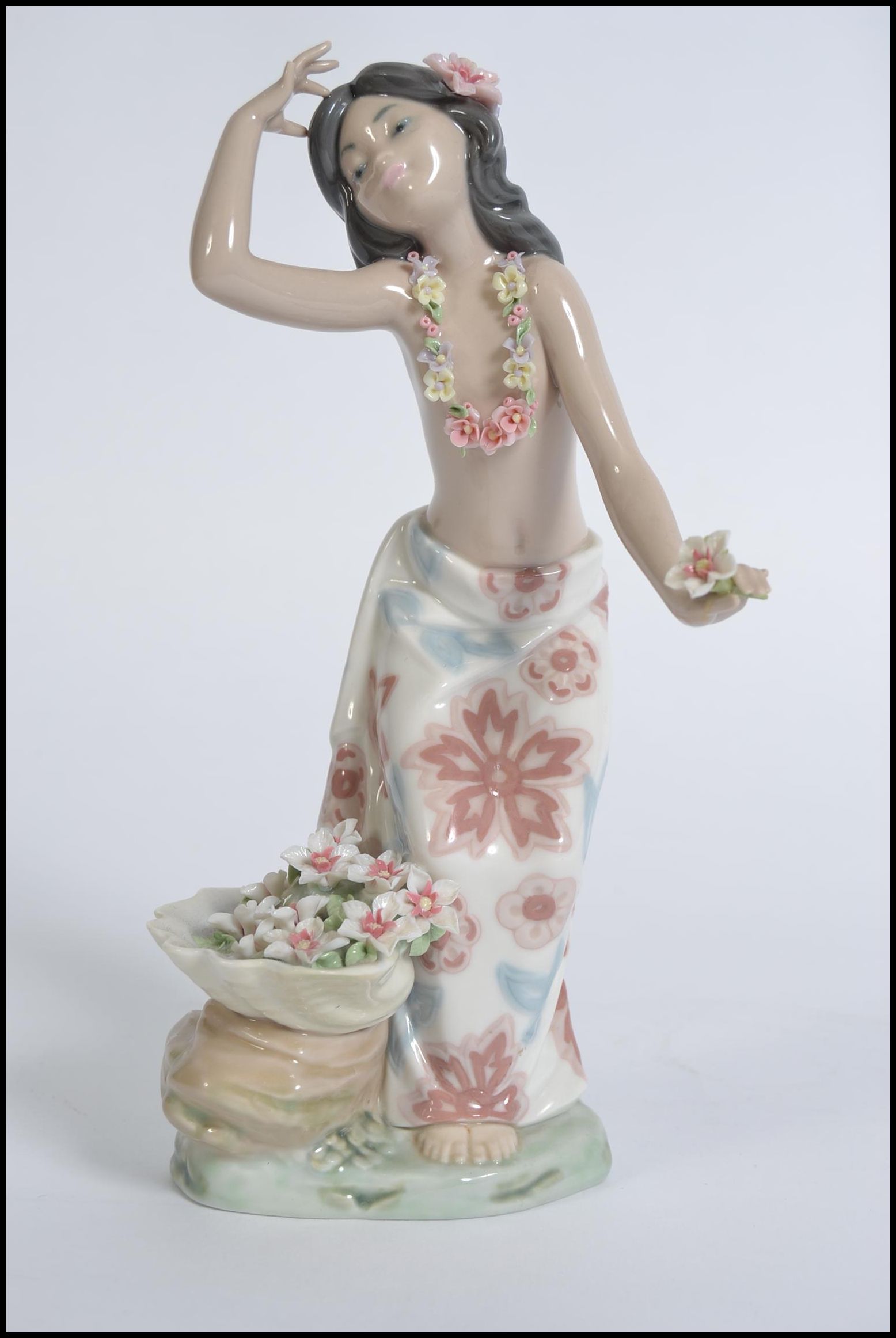 A Lladro porcelain figurine modelled as Hawaiian Dancer entitled Hawaiana de la Concha, no 1478.