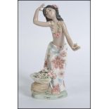 A Lladro porcelain figurine modelled as Hawaiian Dancer entitled Hawaiana de la Concha, no 1478.