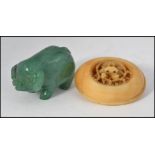 A small 20th century Jade carving of a pig, approx 4cm in length,