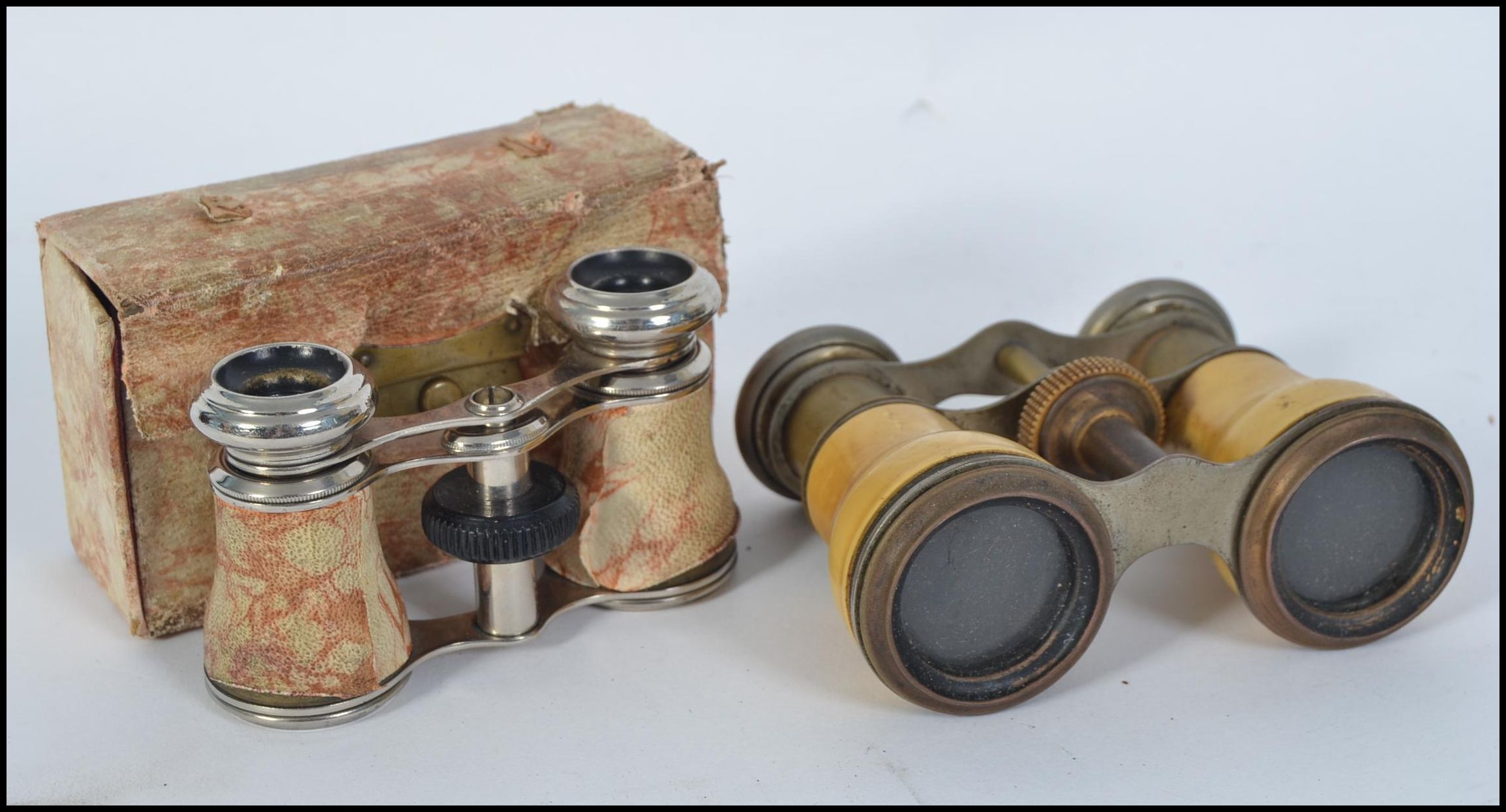 A pair of 19th / 20th century opera glasses along with another pair retaining it's original case
