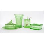 A collection of Art Deco early 20th century green glass / Vaseline pieces to include a stunning