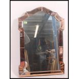 A 1930's Art Deco peach glass mirror of Venetian form the central mirror with peach glass panelled