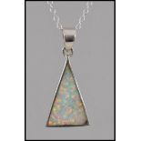 A ladies silver and opalite pendant necklace and chain, the opalite pendant of triangular form.