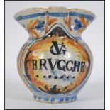 A Small 19th Century Faience possible Apothecary Jug inscribed V G BRVGGHE below the pinched spout