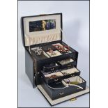 A good quality jewellery box containing a collection of costume jewellery such as necklaces,