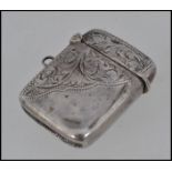 A silver hallmarked vesta case with rococo chases design.