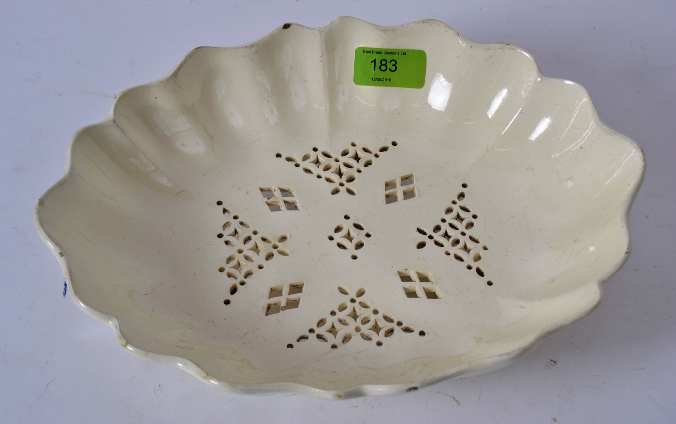 A Creamware Drainer Dish believed late 18th century of fluted oval form having nine foliate and - Image 2 of 5