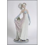 A Lladro figure of a 1920's lady " Dama Charleston ", 5283, height 35cm stamped to base.