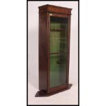 An early 20th century oak cased gun cabinet,