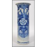 A 19th century Chinese tall blue and white cylindrical vase having scenes of nesting birds and