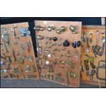 A fabulous collection of 3 boards of mounted handles, hinges, doorknobs,