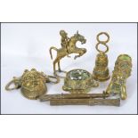 A collection of mid 20th century Indonesian / Asian brass deitys and other metalwares to include