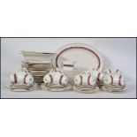 A Royal Doulton Minuet dinner / tea service / part service model H5026 comprising cups, saucers,