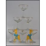 A collection of 6 Babycham glasses having yellow fawns together with 2 plastic Babycham fawn