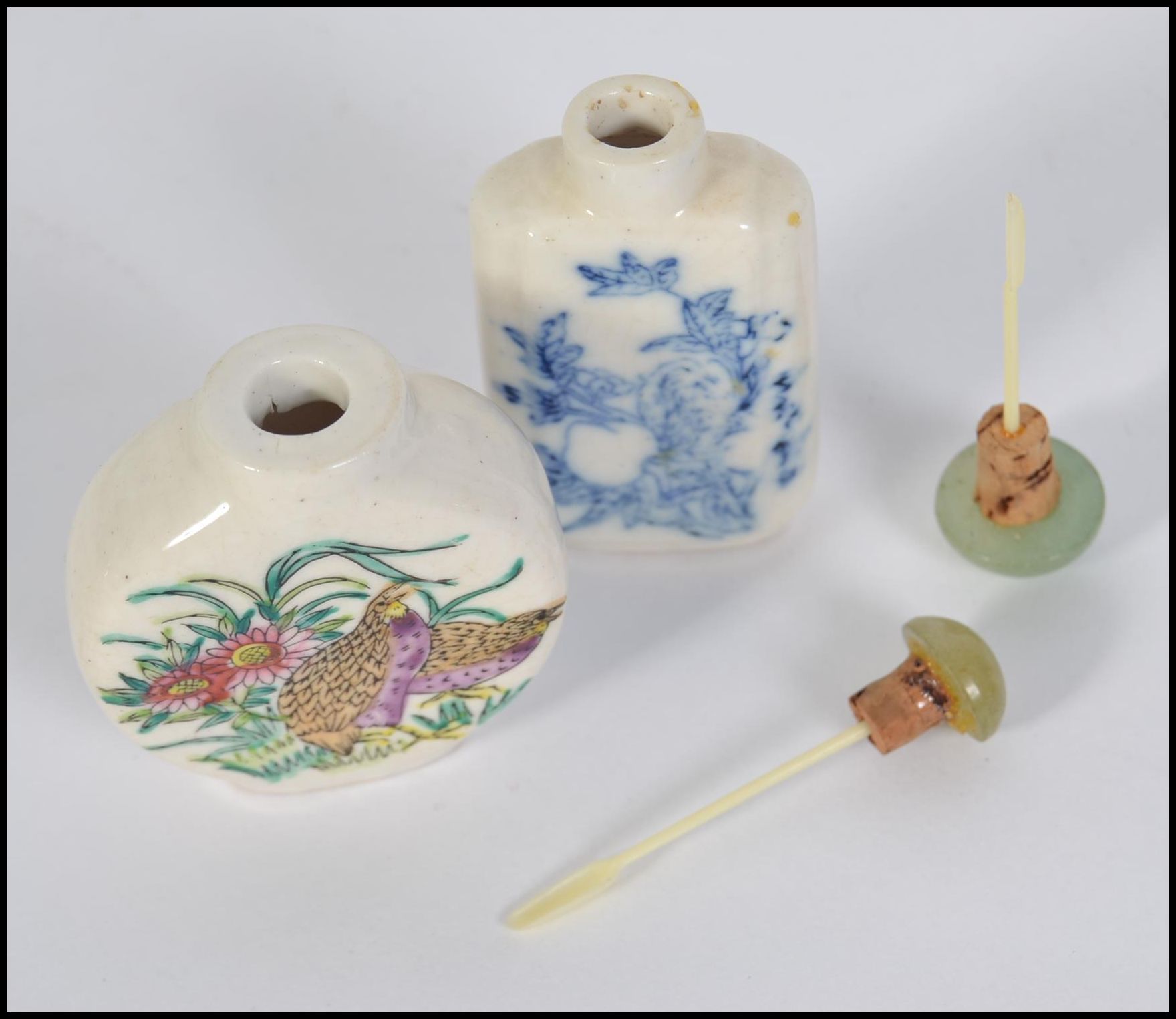 Two 20th century Chinese ceramic snuff bottles both with Jadite stoppers, - Image 3 of 4