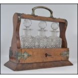 A stunning Victorian miniature walnut and cut glass 3 piece tantalus / decanter set.