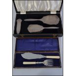 A silver hallmarked cased dressing table set,