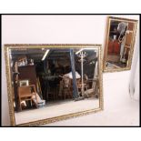 A large 20th century antique style mirror with gilt frame and bevelled edge mirror glass to centre.