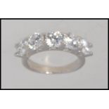 A contemporary ladies silver having inset 5 stone cz's. Total weight 4.9g / Size n.