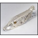 An interesting silver plated paper clip desk tidy in the form a fish