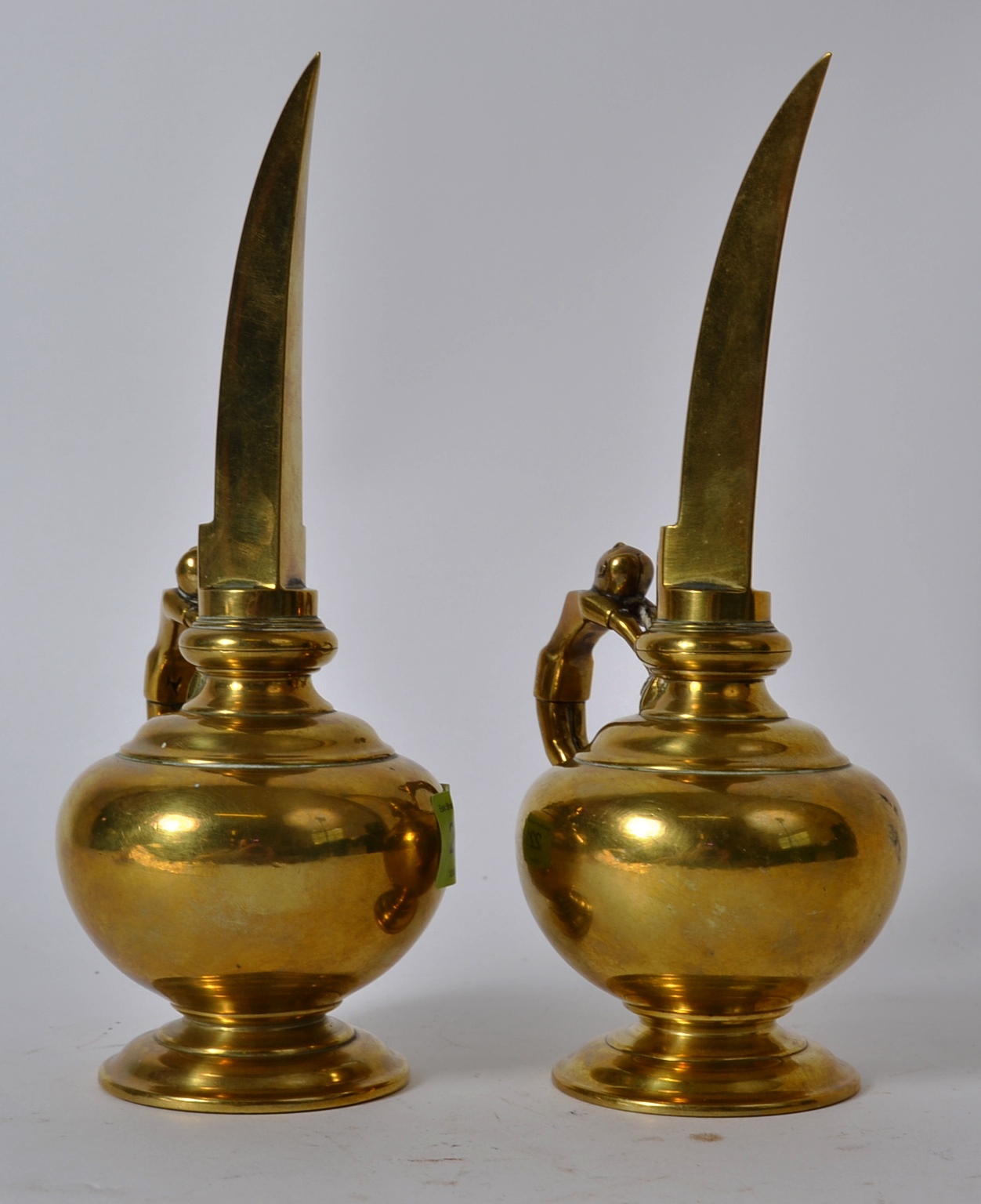 A pair of late 18th / early 19th century Indian long spouted temple oil ewers with anthropomorphic - Image 2 of 4