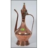 A tall early 20th century middle eastern copper metalware coffee pot, probably Turkish,