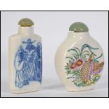 Two 20th century Chinese ceramic snuff bottles both with Jadite stoppers,