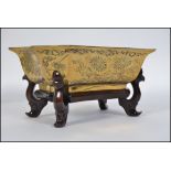 A good quality heavy brass bowl of Chinese origin having chase decorations of dragons and foliate