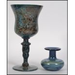 A Monart / Vasart style wine goblet / glass of mottled blue design along with a similar hand made