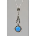 A silver and marcasite opal pendant necklace and silver chain.