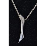 A Danish silver 925 contemporary ladies pendant in the manner of Georg Jensen set to a kerb link