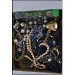 A collection of costume jewellery to include necklaces etc.