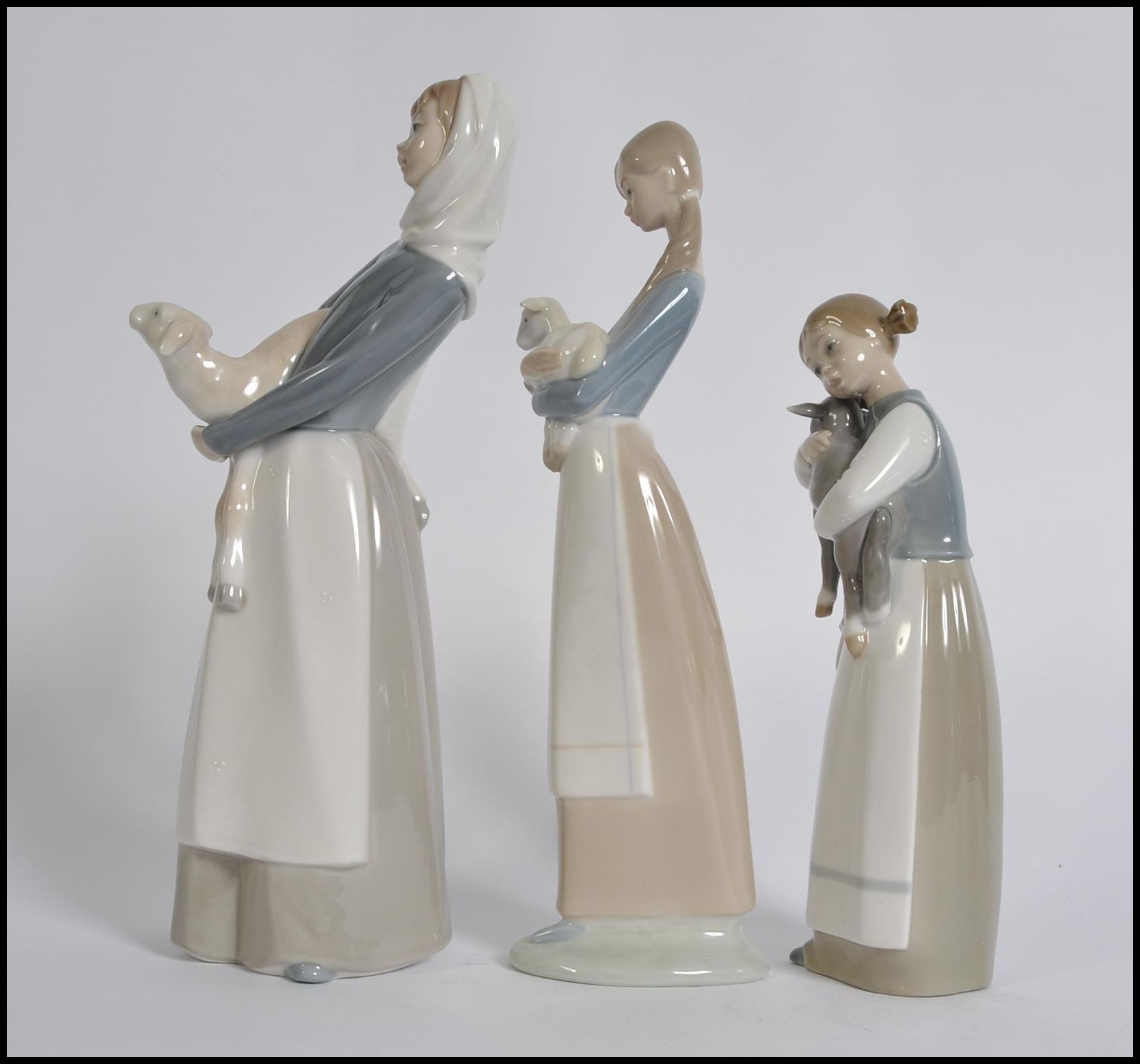 A collection of three Lladro porcelain figurines of young girls with animals, - Image 2 of 5