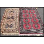 2 Turkish 20th century machine woven rugs, one with red ground and black geometric design,
