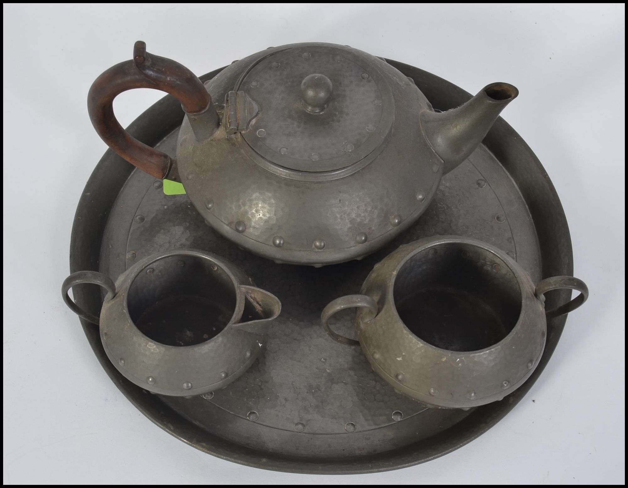 An Arts & Crafts pewter 4 piece tea service comprising teapot, sugar bowl, creamer and tray. - Image 2 of 3