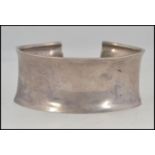 A contemporary silver white metal 925 Danish influence ladies silver bracelet having inverse bow