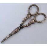 A pair of silver and steel 19th century embroidery scissors with crown and floral handles and