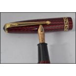 A believed 1960's Conway Stewart 74 ' Speedy-Phil ' red herringbone fountain pen having greek key