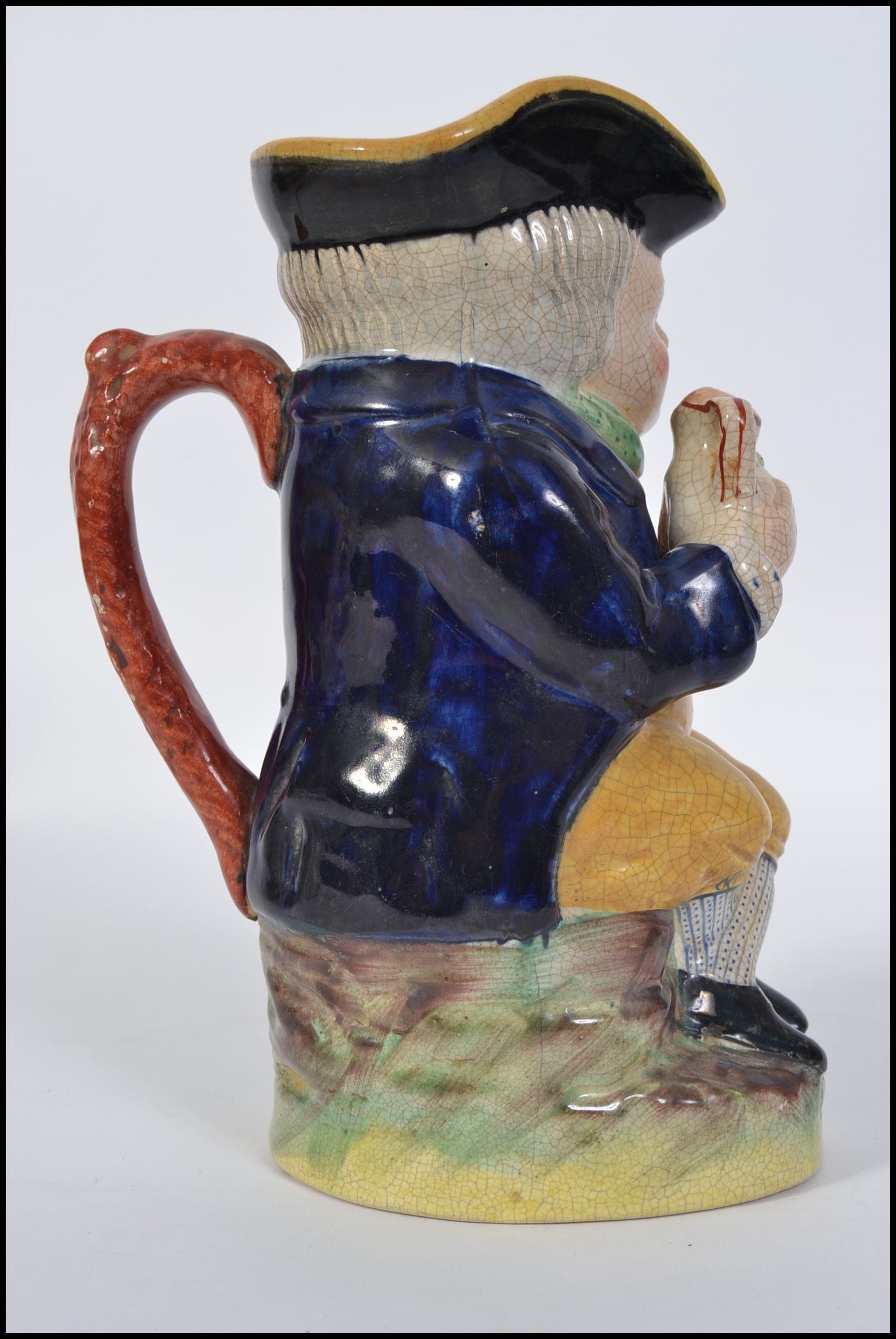 A 19th century Staffordshire Ralph Wood-type Toby jug in the form of a seated Toby Fillpot holding - Image 3 of 5