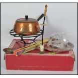 A retro 1970's cased spring of Switzerland Gourmet Line Fondue set, consisting of pan, burner,