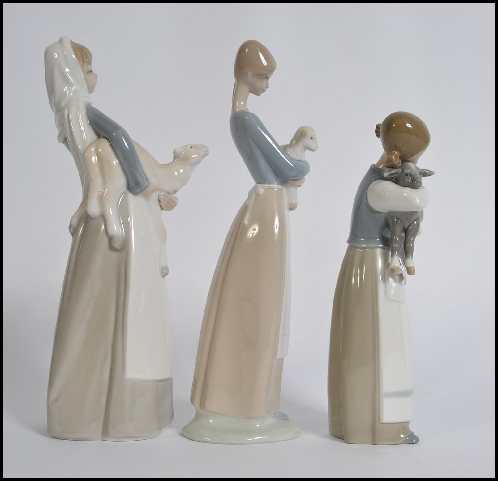 A collection of three Lladro porcelain figurines of young girls with animals, - Image 4 of 5