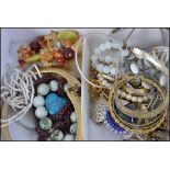 A collection of costume jewellery to include 925 silver earrings, white and yellow metal necklaces,