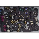 A collection of 30+ costume / dress jewellery earrings of various forms and styles (please see