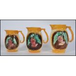 A set of 3 Victorian graduating majolica jugs in the manner of George Jones each with yellow