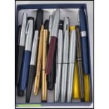 A collection of vintage Shaeffer fountain pens and ballpoint pens dating to the 20th century