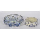 A stunning mid century studio art glass dish with blue glass swirl centre together with a delft